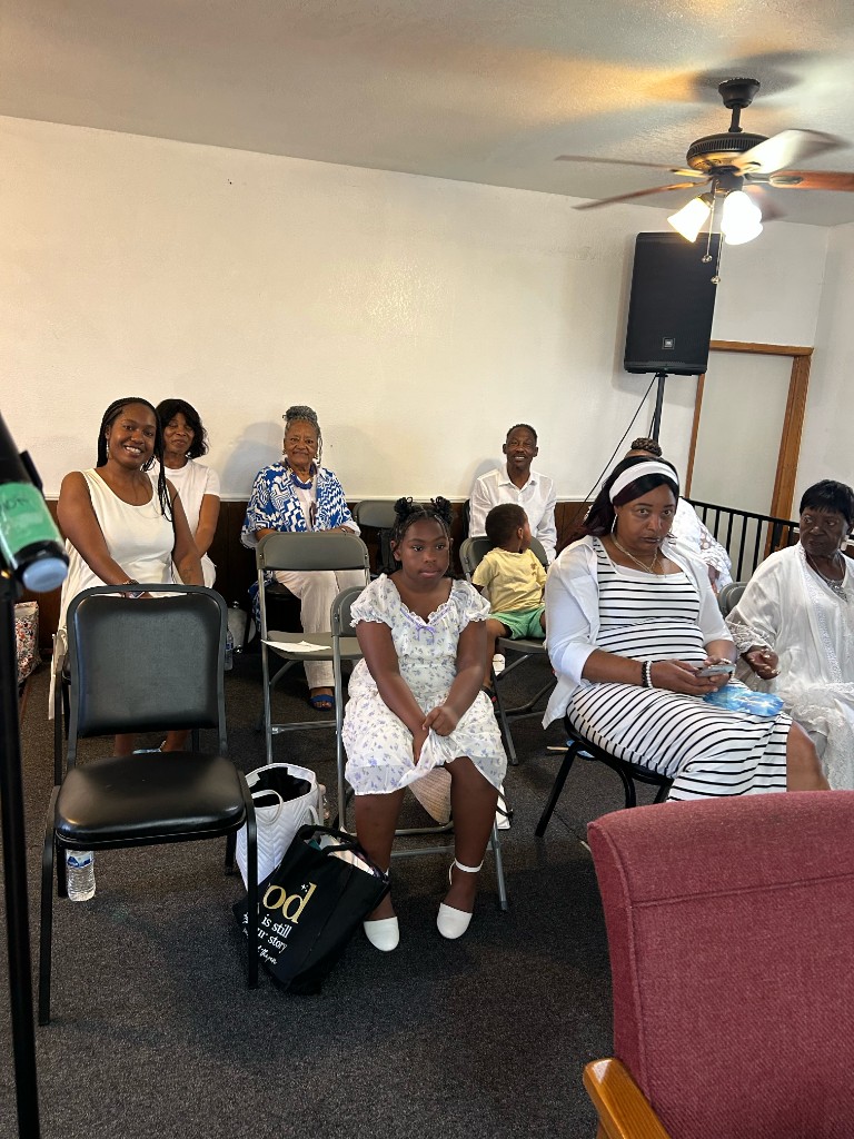 Members fellowshipping before service